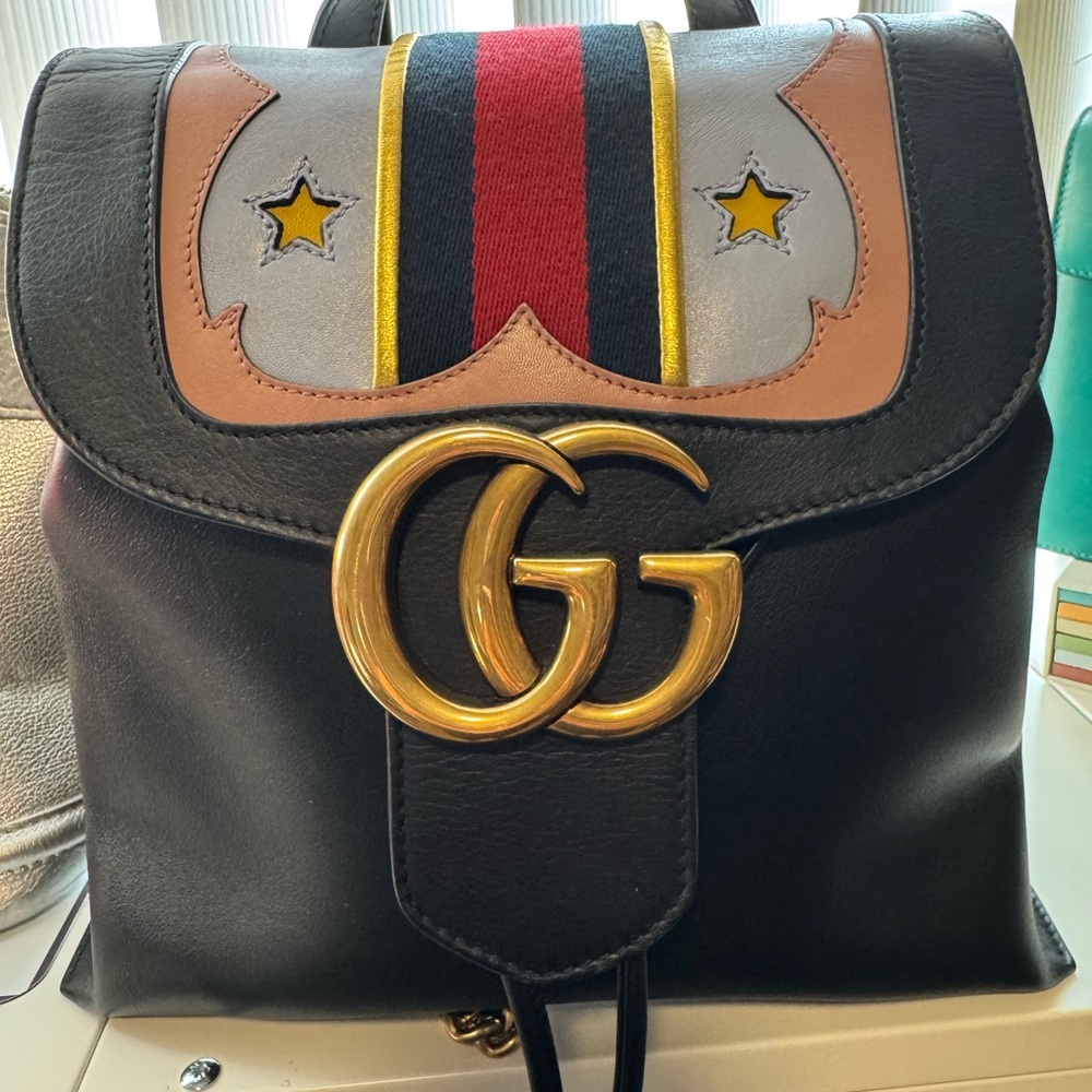 Gucci Black and Gold Backpack with Iconic GG Logo